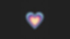 a blurry image of a heart on a black background