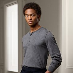 This Henley shirt’s interlock fabric is crafted with premium cotton that offers maximum durability resistance to pilling and a luxuriously soft hand. It is also custom-dyed to our exacting specifications. Business Casual Cotton Crew Neck Top, Gray Cotton Henley Neckline Top, Gray Cotton Tops For Business Casual, Gray Cotton Top For Business Casual, Classic Long Sleeve T-shirt For Work, Ralph Lauren Relaxed Fit Long Sleeve Tops, Classic Ralph Lauren Long Sleeve Tops, Fitted Ralph Lauren Tops For Business Casual, Ralph Lauren Long Sleeve Cotton Top