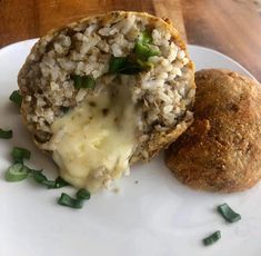 a close up of a plate of food with broccoli and cheese on it