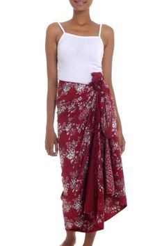 Using Javanese wax-resist dyeing techniques that date back centuries Nyoman Nadri creates this beautiful rayon batik sarong. The hand-stamped pattern features a floral motif in white and grey on a rich claret background. Graceful fringe finishes both ends. Whether you wear it as a skirt or as a cover-up at the pool this pretty sarong will sweep you away to the tropics. Bohemian Red Batik Print Sarong, Traditional Red Sarong For Summer, Bohemian Silk Sarong, Burgundy Clothing, Pattern Clothing, Batik Sarong, Cover Up Beach, Batik Pattern, Swimwear Cover