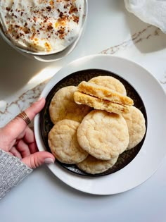 a white plate topped with cookies on top of a table