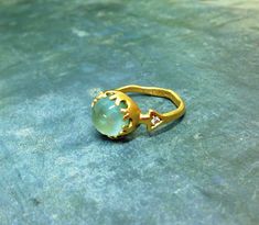 Unique engagement ring set with 10 mm Aquamarine. You can order it made of 14 karat gold and set with 1 points diamond on each side of the big ring, Or made of gold plated brass, with Cubic Zirconia instead of the diamonds. See here another option from this collection: https://www.etsy.com/il-en/listing/195958111/woman-gold-ring-with-daimonds-and?ref=shop_home_active_6 Aquamarine Ring Gold, Wide Gold Ring, Wide Wedding Rings, Gems Ring, Funky Rings, Hippie Rings, Alternative Engagement Ring, Cross Earrings Studs, Signet Ring Men