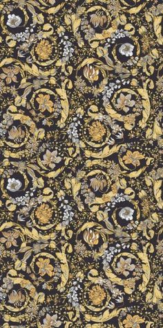 an intricately designed wallpaper with flowers and leaves on it's black background