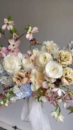 a bouquet of flowers sitting on top of a table