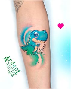 an arm tattoo with a blue and green dinosaur on it