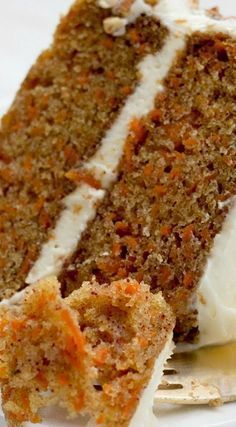 a slice of carrot cake on a white plate