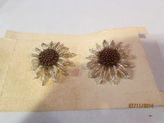 In Our Jewelry collection today we have a a vintage pair of clip on earrings Star Burst 7838 by Sarah Coventry feel free to make an offer if not on sale  Be sure to check out our other vintage & new Christmas Decorations  in our store.. we have a very large selection of mostly vintage Christmas items We will gladly wrap this and send it to your loved one free of charge...     Shipping and handling will be free and includes a delivery confirmation.. Please visit our other auctions for more Hallow Earrings Star, Star Burst, Halloween Items, Earring Cards, Sarah Coventry, Vintage Jewels, Christmas Items, Coventry