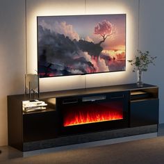 an entertainment center with a large television mounted on it's wall and a fire place in front of it