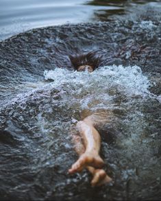 a person floating on top of a body of water