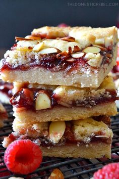 raspberry almond bars stacked on top of each other