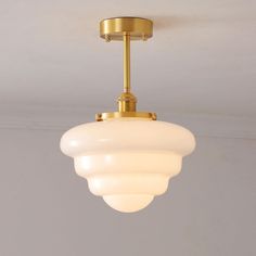 a light fixture hanging from the ceiling in a room