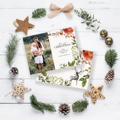 two christmas cards on top of pine cones