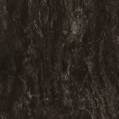 a black marble textured wall with dark colors