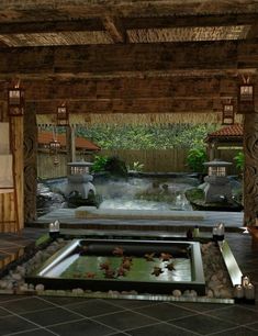 an indoor japanese garden with water and rocks