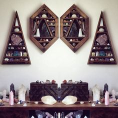 a table topped with lots of different pieces of furniture next to two wall mounted mirrors