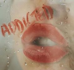 a close up of a person's lips with the word ananda written on them