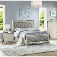 a bedroom scene with focus on the bed and dresser