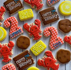 decorated cookies are arranged on a table with the words happy birthday written in icing