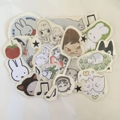 various stickers are arranged on a white surface