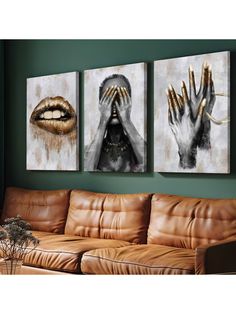 three paintings hanging on the wall next to a brown leather couch in a living room