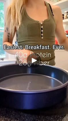 a woman standing in front of a pan on top of a counter