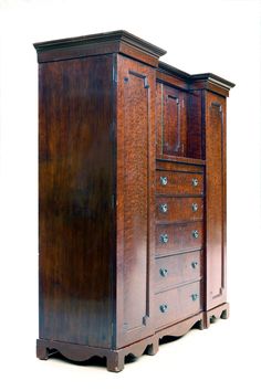 an old fashioned wooden dresser with drawers