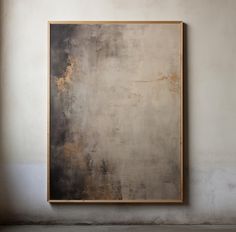 a painting hanging on the wall in an empty room