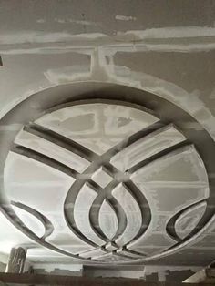 an artistic design on the ceiling in a building