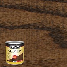 a can of minwax gel stain sitting on top of a wooden flooring