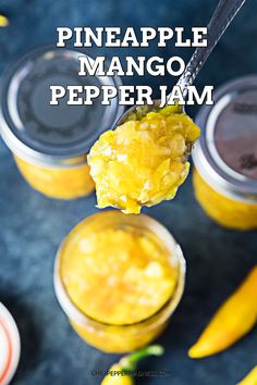 pineapple mango pepper jam on a spoon with two jars in the background and one jar filled with it