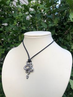 Snake pendant on a black rope necklace with a lobster claw clasp in the back. The rope can be tied in a loose knot if you wanted a shorter length! Due to the nature of my shop and all items being handmade by myself, I cannot offer monetary refunds. Please message me if you are having a problem with your order after receiving it. Black Snake Necklace, Black Locket, Black Rope Necklace, Pirate Jewelry, Gift Wishlist, Necklace Snake, Edgy Jewelry, Writing Motivation, Snake Pendant