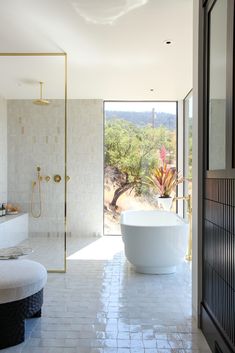 a large white bath tub sitting next to a walk in shower