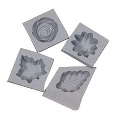 four leaf shaped cookie cutters on top of each other