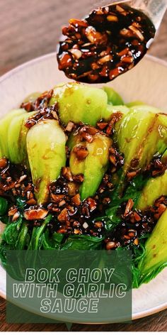 a white plate topped with sliced avocado and sesame seeds