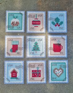 six cross stitch coasters with different designs on them