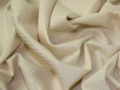 a close up view of a white fabric