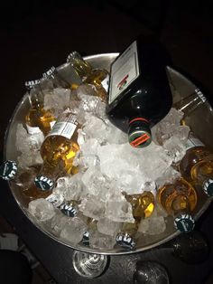 an ice bucket filled with beer bottles and ice