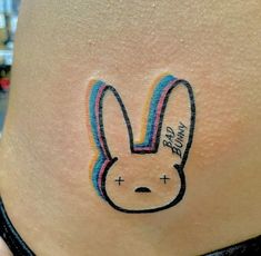 a woman's stomach with a bunny face drawn on the side of her belly