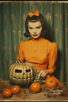 a woman in an orange dress is holding a pumpkin