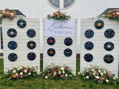 a group of white boards with flowers on them