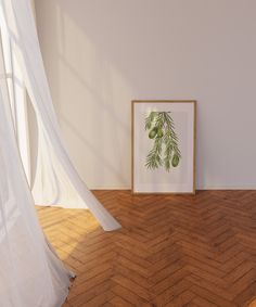 an empty room with wood flooring and a framed print on the wall next to it