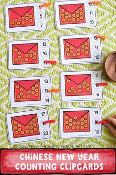 the chinese new year counting clip cards are displayed on a green and white tablecloth