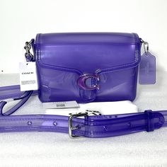 Authentic COACH Tabby Jelly crossbody bag.  New with tags. Includes wristlet strap, crossbody strap, bag charm, and dust bag. Photos are of the actual bag you will receive (*except stock images are for reference only).  Product Details:  Coach Jelly Tabby  style no. CH748 Color: Bright Purple Silver-tone HardwarePushlock closure Detachable wrist strap  Detachable strap with 21.5" drop  Approx. 8.75" (L) x 5.75" (H) x 3" (W) Dust Bag Included Coach Tabby, Purple Accessories, Bright Purple, Wrist Strap, Shades Of Purple, Jelly, Bags Handbags, Dust Bag, Crossbody Bag