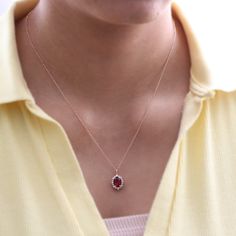 This timelessly elegant oval ruby necklace is set in the lustrous 14k gold tiara halo diamond drop pendant featuring an oval-shaped vivid red ruby surrounded by brilliant white diamonds that dangle beautifully from a solid gold cable chain. The length of the gold chain can be adjusted to either 16" or 18" long to suit your style! This ruby and diamond necklace can be crafted in your choice of white, rose, or yellow gold. ** The listing price is for one necklace only Availability: Ready to Ship: Luxury Classic Necklace With Lab-created Ruby, Rubi Necklaces, Unique Pendant Necklace Gold, Gold And Ruby Necklace, Oval Red Rose Cut Diamond Jewelry, Oval Red Jewelry With Halo, Oval Red Halo Jewelry, Diamond Pendants Designs Unique, Red Diamond Necklace