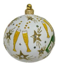 a glass ornament with champagne and stars on it