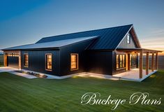 an image of a house that is in the middle of a grassy field at sunset