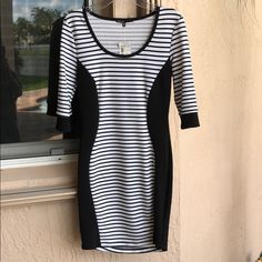 3/4 Sleeve Black And White Striped Bodycon Dress With Black Sides And Cuffs. Very Flattering On. Good Staple Dress That Can Be Dressed Up Or Down. White Fitted Mini Dress With 3/4 Sleeve, Fitted Mini Dress With Half Sleeves For Night Out, Fitted Half Sleeve Mini Dress For Night Out, Casual Fitted Mini Dress In Black And White, Black Tube Dress, Dresses Black And White, Vintage Velvet Dress, Black And Blue Dress, Staple Dress