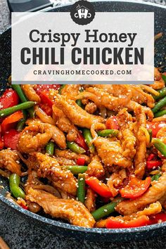 chicken and peppers in a skillet with the words crispy honey chilli chicken