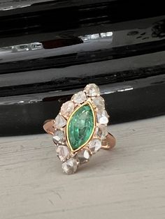 A ring of dreams! From the late Victorian era this gorgeous Colombian light green Marquise cut Emerald has been bezel set amongst a delightful set of rose cut diamonds. Definitely hard to miss in a crowd! The emerald has an incredibly bright and sparkling colour from whatever angle you see it from and is really complimented by the cut of the diamonds. The emerald has an estimated weight of 1.20 carats. Measuring 11 x 6 x 4.05mm The beautiful Rose cut diamonds have an estimated weight of 0.50 car Emerald Color, Colombian Emeralds, Marquise Cut, Large Hoop Earrings, Art Deco Ring, Rose Cut Diamond, Multi Stone, Multi Stone Ring, Rose Cut