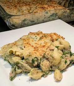 a casserole dish with broccoli and chicken in it on a white plate